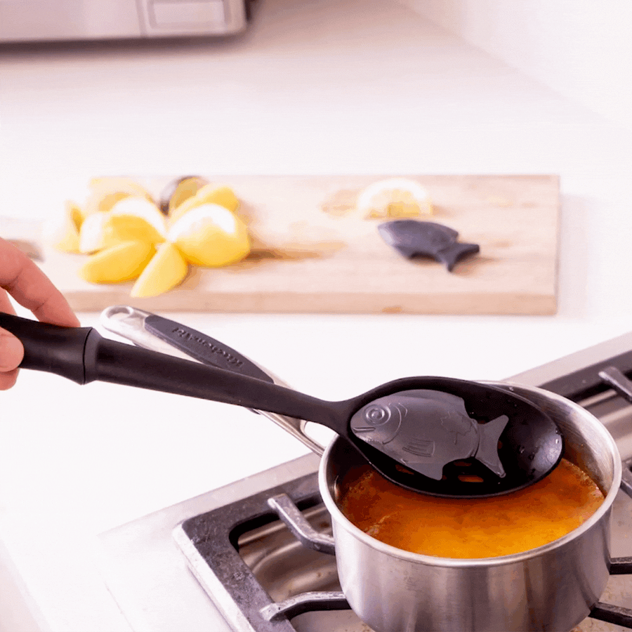 Lucky Iron Fish fortifying a pot of soup with extra iron