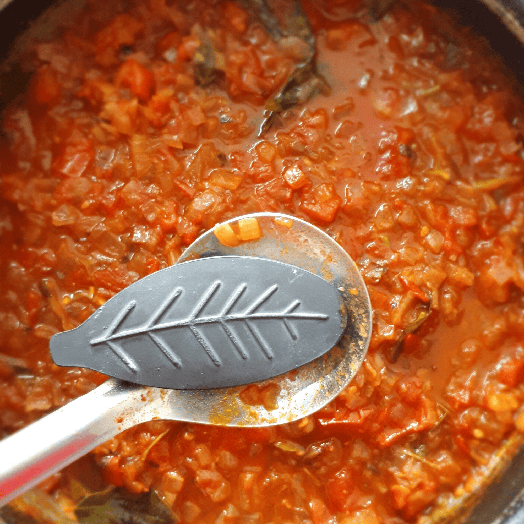 Lucky Iron Leaf cooking with tomato sauce